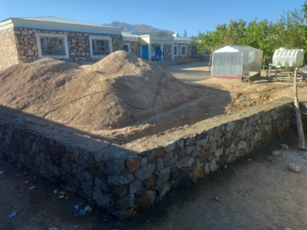 Stone boundary wall corner built near the school building at Captain Taj Mohammad Khan Lycee