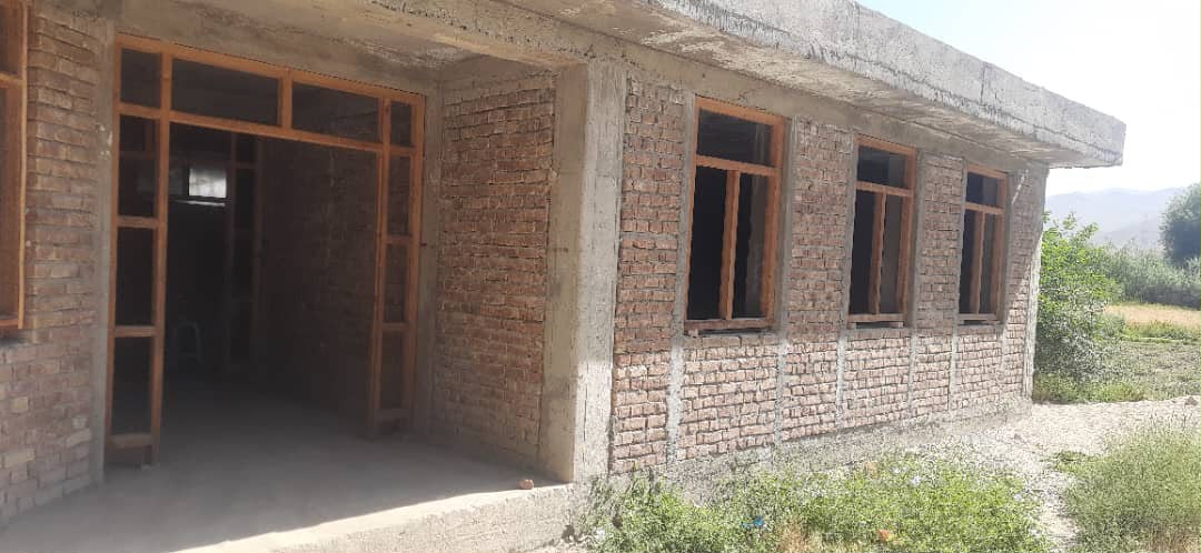 Shikh Abad Girls School classroom building under construction, brick walls with window frames