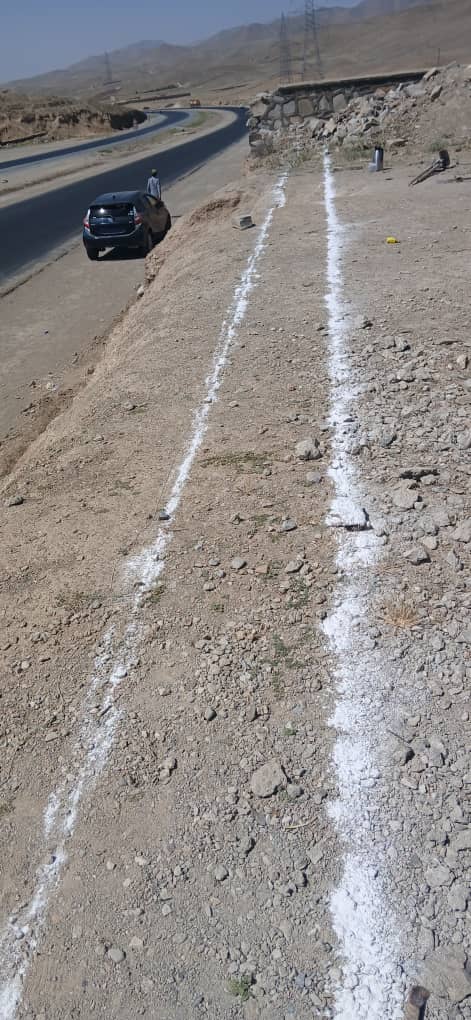 Marking the new boundary wall line along the roadside at Zarni Lycee